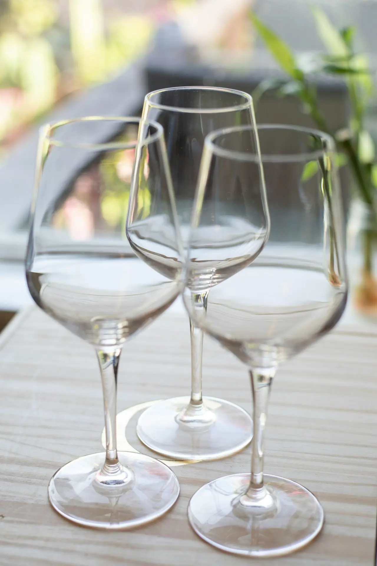 two empty wine glasses sitting on a table