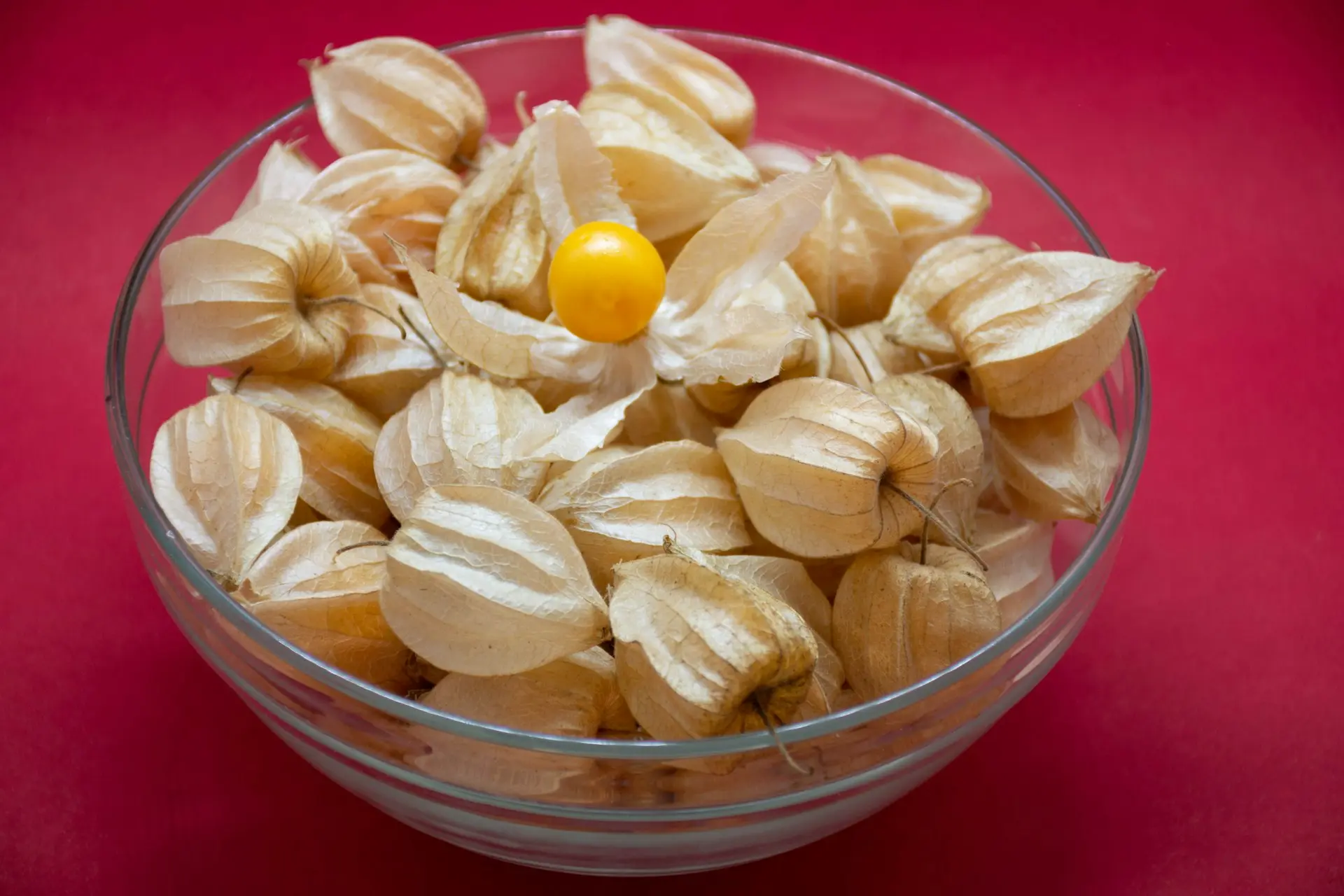 clear glass bowl with yellow and pink candies